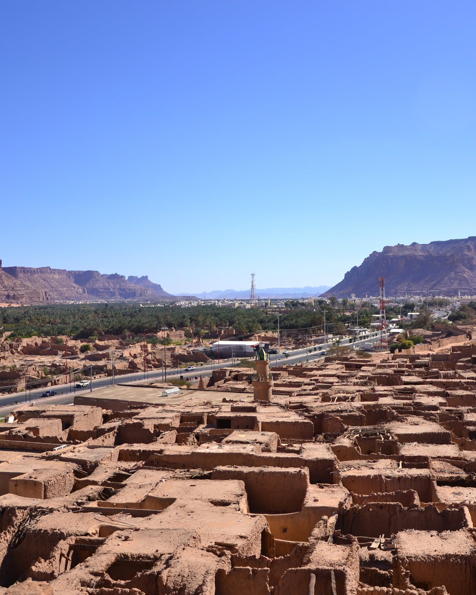 The old town of AlUla, with the oasis beyond